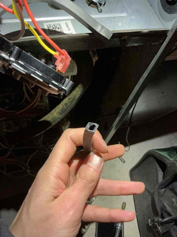 Responded to a no-heat call on previously serviced furnace with recurring issues. Diagnosed multiple problems including damaged rollout switch connection, improperly positioned tubes, and clogged condensation trap. Repaired the rollout switch wiring, repositioned tubes, and cleaned the condensation trap to restore proper operation.