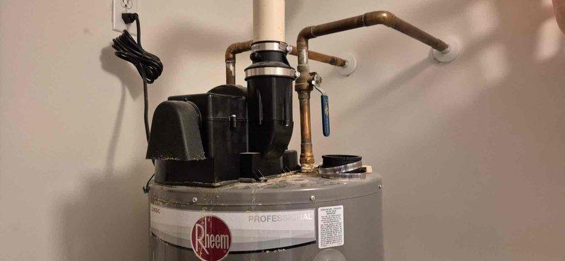 Diagnosed Rheem 40-gallon POWER VENT water heater with active leak. Inspection revealed compromised internal glass lining, resulting in water corrosion through the aluminum shell. Unit deemed unrepairable; provided replacement options to customer.