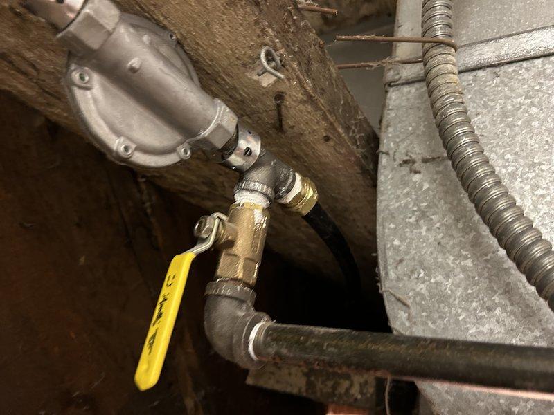 Removed outdated gas supply infrastructure and installed new flexible gas lines with proper fittings to service furnace and water heater from existing copper main. System was thoroughly leak-tested following installation to confirm proper operation and safety compliance.