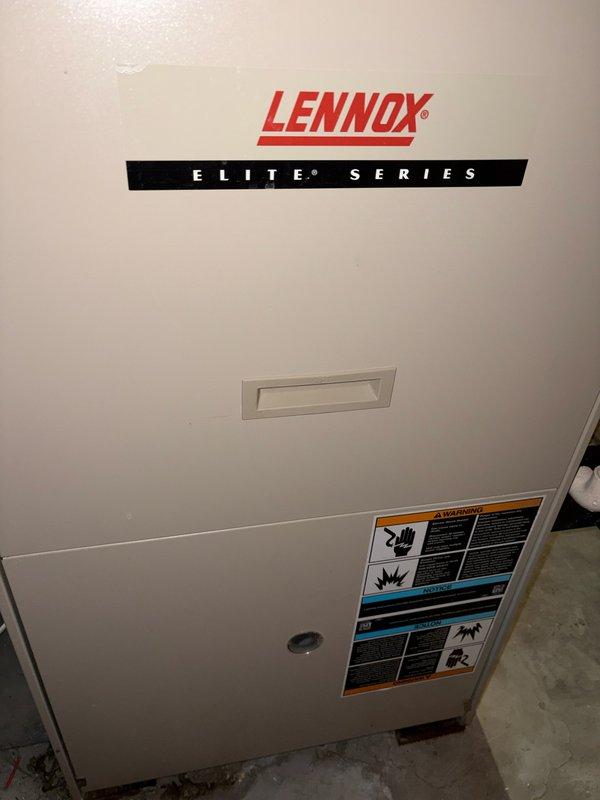 Responded to service call for Lennox Elite Series furnace with intermittent ignition failures requiring daily resets. Diagnosed and cleaned corroded flame sensor, inspected heat exchanger, and verified all electrical components were within specifications. Furnace subsequently operated properly with normal heating function. Identified minor water leak from collector box and presented repair options to homeowner. Customer declined immediate collector box repair but may consider complete system replacement in summer due to unit's 20-year age.