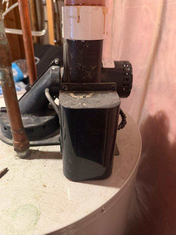 Diagnosed and replaced failing power vent blower motor on 24-year-old natural gas water heater. Upon inspection, blower motor was making excessive noise during operation. Due to unit age and condition, recommended and installed complete water heater replacement rather than component repair.