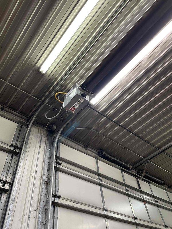 Responded to no-heat call for shop heater. Diagnostic inspection revealed damaged neutral wire where incoming power connector had been rubbing against inducer wheel, preventing unit from receiving power. Installed 14-gauge wire to replace damaged section, restored power to unit. System now operating correctly with proper heating function.