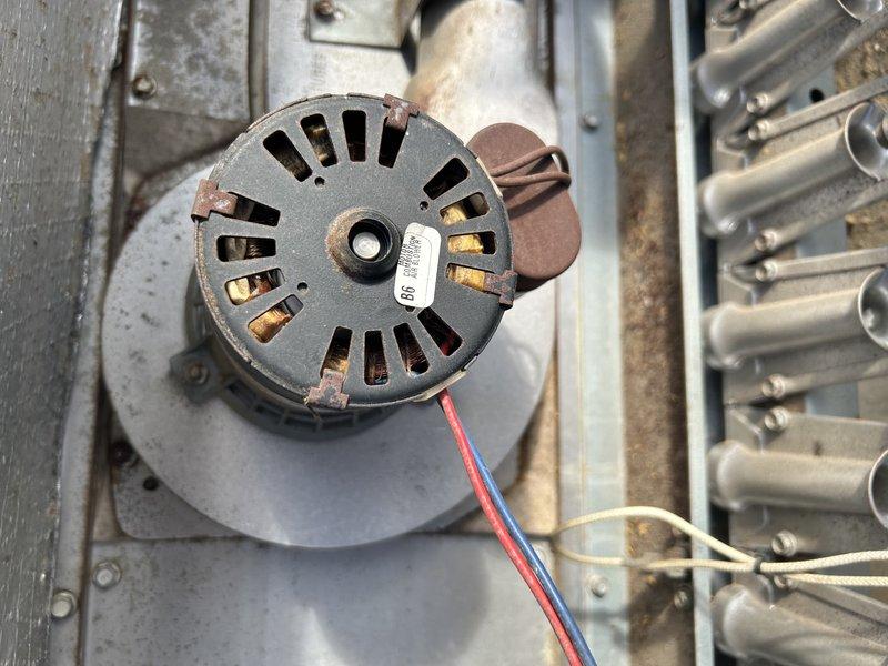 Responded to no heat complaint at commercial property for 10+ year old RTU serving the foyer area. Diagnosed locked combustion blower motor as the cause of heating failure. Performed temporary repair by manually freeing the blower and lubricating components. Conducted heat exchanger inspection with no cracks or holes observed. Customer approved estimate for replacement of combustion blower assembly.