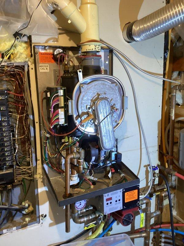 Responded to service call for Munchkin Contender boiler in protect mode with no heat output in shop area. Diagnostic inspection revealed failed heat exchanger with water leaking directly from condensate. Customer declined replacement recommendation, opted to source heat exchanger independently. Advised customer we would not install customer-supplied heat exchanger but submitted parts inquiry for availability and pricing information.