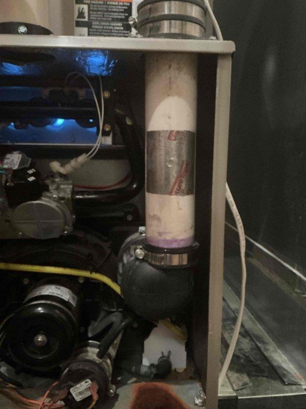 Performed comprehensive tune-up inspection on 14-year-old Carrier furnace. Verified good condition of blower motor, draft motor, capacitors, control board, and gas valve with normal combustion readings. Discovered and documented critical safety issue: hole in primary heat exchanger near the high limit. Due to potential carbon monoxide hazard, performed mandatory safety shutdown of equipment and explained necessity to homeowner.