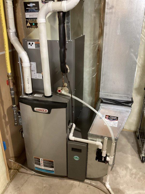 Performed comprehensive tune-up on 2-year-old Lennox LP furnace. Inspected all standard components with no issues found. Replaced MERV 16 filter as requested. Customer reported white specks on floor and excessive dust; thorough inspection revealed no dust sources within the furnace or ductwork system, which appeared clean throughout.