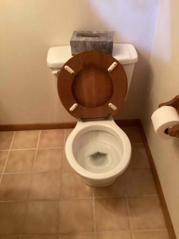 Diagnosed and serviced 20-year-old Eljer toilet with persistent running issue. Observed significant mineral buildup around pipe connections and flapper mechanism that was intermittently functioning. Removed and replaced with new tall round toilet as requested by customer, ensuring proper installation and function before completion.