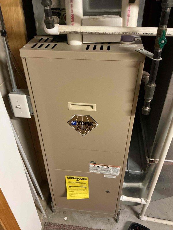 Performed second opinion inspection on York furnace with suspected cracked heat exchanger. Confirmed crack in collector box requiring replacement along with inducer motor. Recommended full system evaluation for potential replacement options.