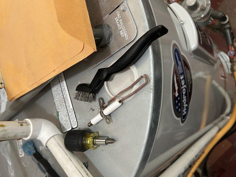 Performed boiler tune-up service which included operational testing, igniter removal/inspection, and heat exchanger assessment. Found significant buildup in heat exchanger requiring cleaning, loose igniter causing exhaust gas leakage that melted surrounding insulation and ground wire. Secured broken screw holding igniter and noted missing gasket underneath igniter. Customer elected to proceed with igniter replacement but deferred heat exchanger cleaning.