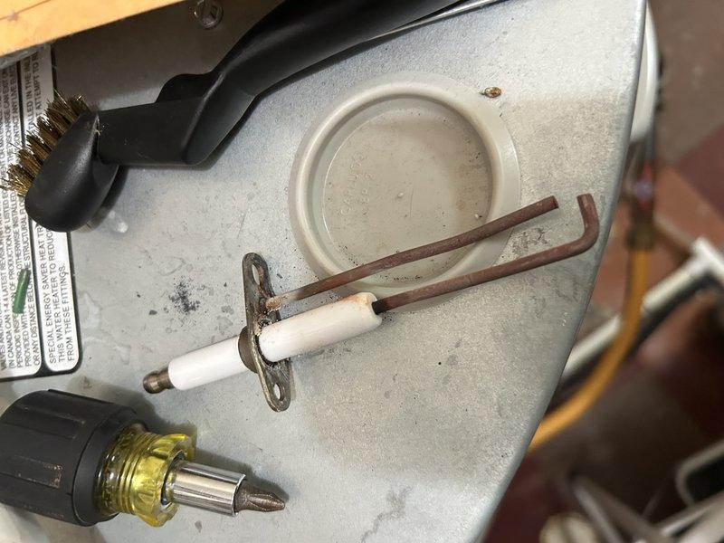 Performed boiler tune-up service which included operational testing, igniter removal/inspection, and heat exchanger assessment. Found significant buildup in heat exchanger requiring cleaning, loose igniter causing exhaust gas leakage that melted surrounding insulation and ground wire. Secured broken screw holding igniter and noted missing gasket underneath igniter. Customer elected to proceed with igniter replacement but deferred heat exchanger cleaning.