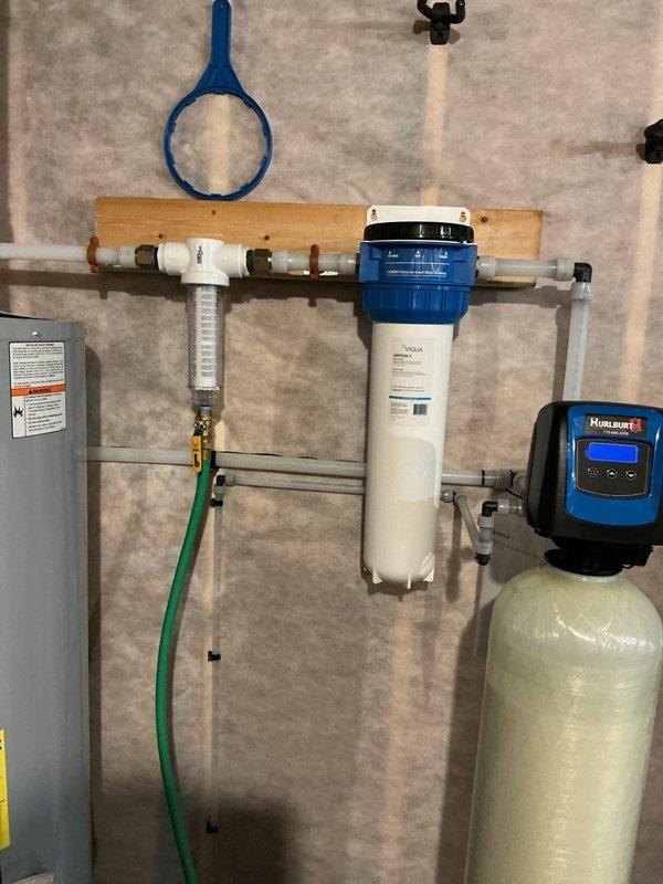 Responded to warranty service call regarding cloudy water issue. Inspected water filtration system and found sediment from previously installed neutralizer. Repositioned sediment filter to downstream position from neutralizer to resolve the problem.
