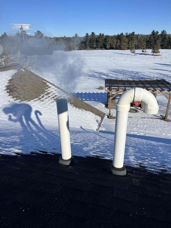 Responded to no heat call for Weil-McLain boiler system. Discovered small beehives obstructing the intake/exhaust venting and a dirty flame sensor. Cleaned accessible obstructions from venting and thoroughly cleaned flame sensor, restoring proper ignition sequence. System now operating correctly with heat production confirmed.