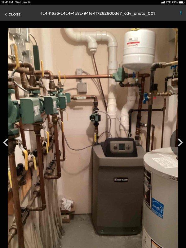 Responded to no heat call for Weil-McLain boiler system. Discovered small beehives obstructing the intake/exhaust venting and a dirty flame sensor. Cleaned accessible obstructions from venting and thoroughly cleaned flame sensor, restoring proper ignition sequence. System now operating correctly with heat production confirmed.