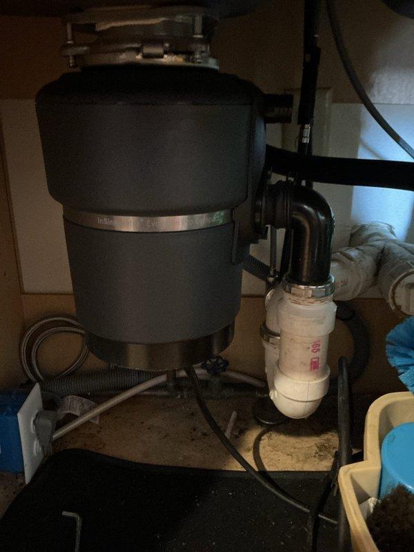 Replaced non-functional 3/4 HP garbage disposal unit in kitchen with new model, completing full installation with proper plumbing connections. Additionally, addressed slow drainage in master bathroom sink by snake cleaning the lavatory drain, successfully removing hair buildup that was causing the blockage.