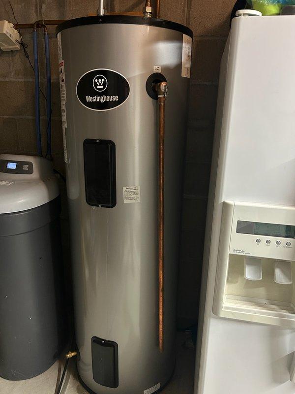 Responded to service call for water heater issue. Investigation revealed tank leak with visible water pooling around the base of Westinghouse water heater. No leaks detected in connections or valves. Assisted customer with filing warranty claim and provided replacement options.