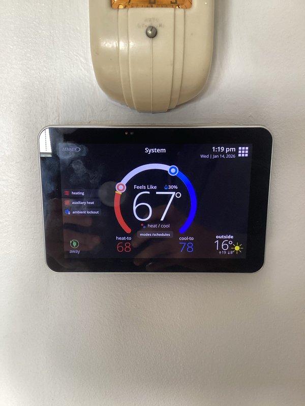 Technician reconfigured network box that was previously installed but experiencing pairing issues. Adjusted equipment settings and verified proper operation of the digital thermostat system, which now correctly displays temperature readings and set points (67° current, 68° heating, 78° cooling).