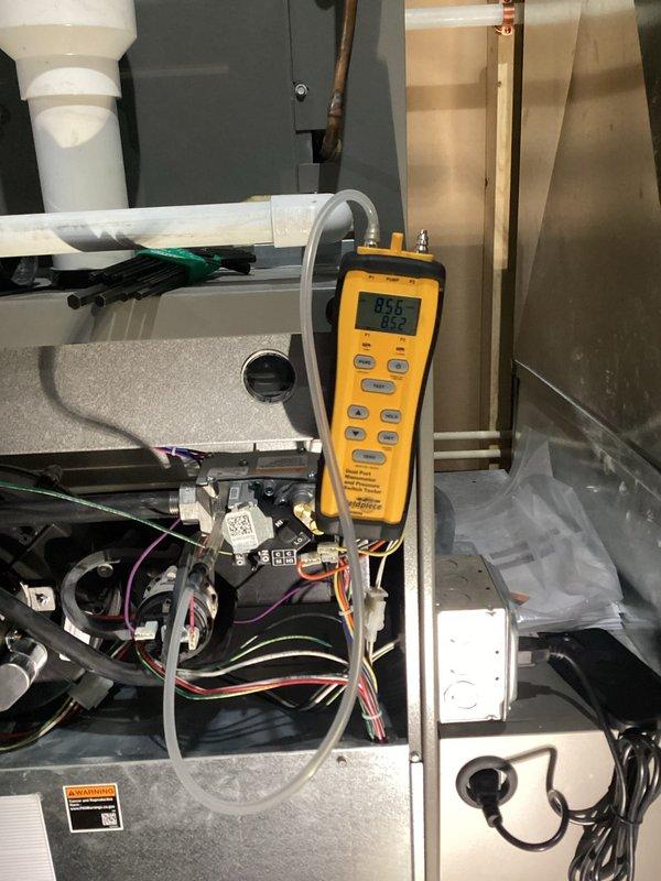 Completed comprehensive furnace tune-up on 5-year-old system. Inspected and verified all components functioning within specifications including clean filter and blower, proper electrical connections, clear condensate lines, and intact heat exchanger. Tested operation with 65-degree temperature rise and confirmed correct gas pressures. Noted service light indicating humidifier cylinder replacement needed; customer requested estimate for this service.