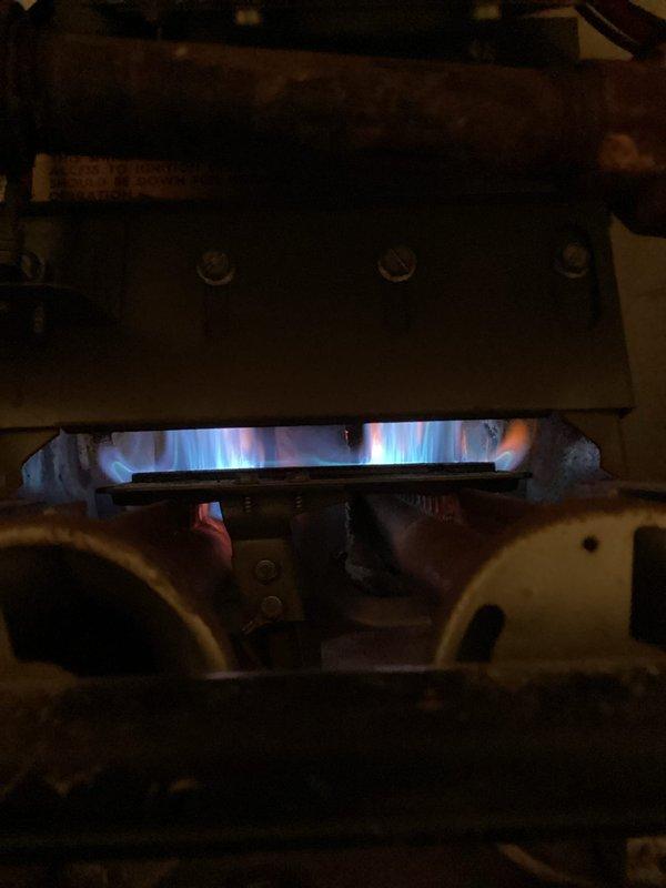 Responded to no-heat service call for a 25-30 year old furnace with intermittent pilot light issues. Diagnosed and cleared plugged pressure switch port, restoring proper operation. Inspection revealed non-compromising scratches on heat exchanger; flame appearance and combustion normal. System tested and verified operational throughout service visit.