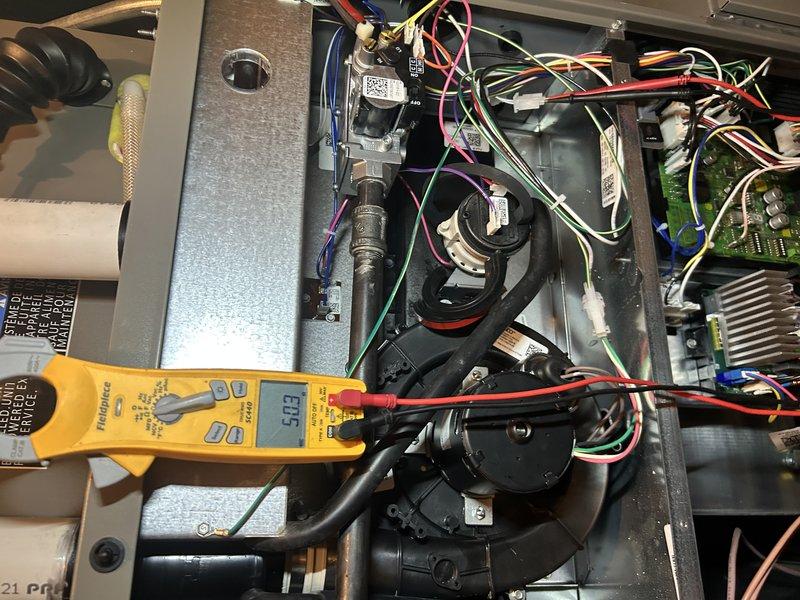 Performed comprehensive furnace tune-up on system less than one year old. Conducted operational testing including gas pressure verification, corrected backwards air filter installation, inspected humidifier and air exchanger, and cleaned routine components. Electrical testing with Fieldpiece meter confirmed proper amperage readings (0.23) across components, and condensate drain was flushed to ensure proper drainage. All systems functioning within normal parameters.