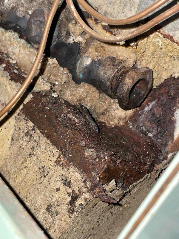 Inspected boiler system and identified catastrophic failure of heat exchanger and sensor well. Water added to boiler immediately leaked through compromised heat exchanger. Informed homeowner that the unit is unrepairable due to discontinued parts availability and extensive damage evidenced by severe corrosion on plumbing components and mechanical fasteners. Homeowner will consider options for boiler replacement.