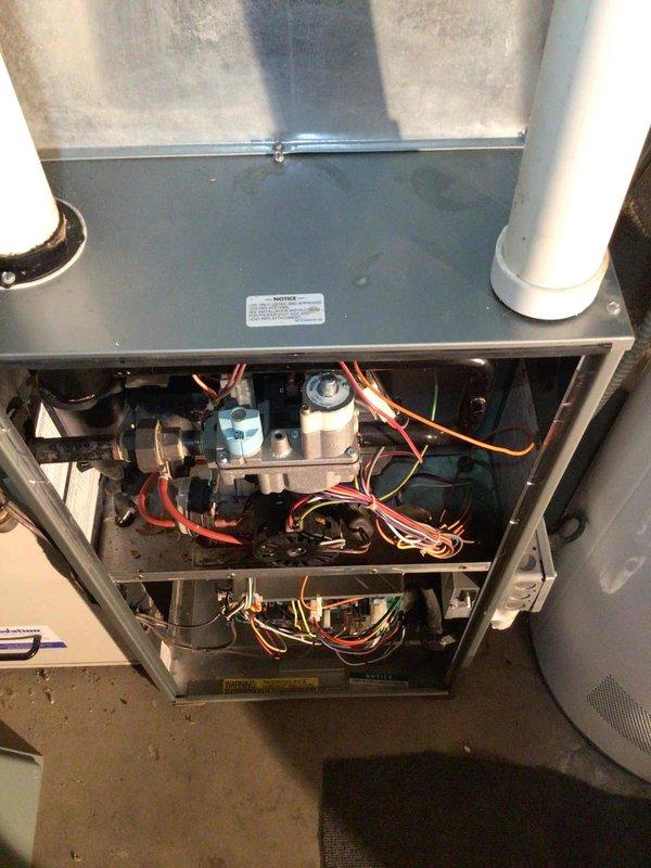 Performed furnace tune-up on 21-year-old FRP unit. Inspected heat exchanger with scope confirming no compromises, cleaned flame sensor, and tested electrical components with all readings within specification. Noted customer recently replaced furnace filter. System is operating properly with no issues identified.