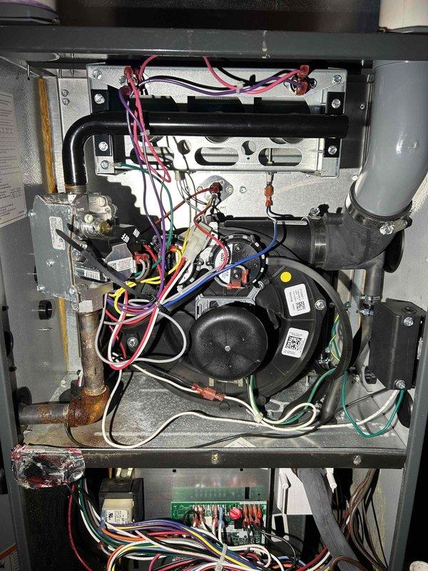 Performed comprehensive furnace tune-up on single-stage unit. Conducted full system inspection including heat exchanger examination for wear, combustion analysis testing, and verification of proper gas pressure. Cleaned pressure switch and inspected flame sensor, burners, and blower assembly. System operating within normal parameters with no immediate concerns identified. Thermostat functioning correctly with adequate heating output.