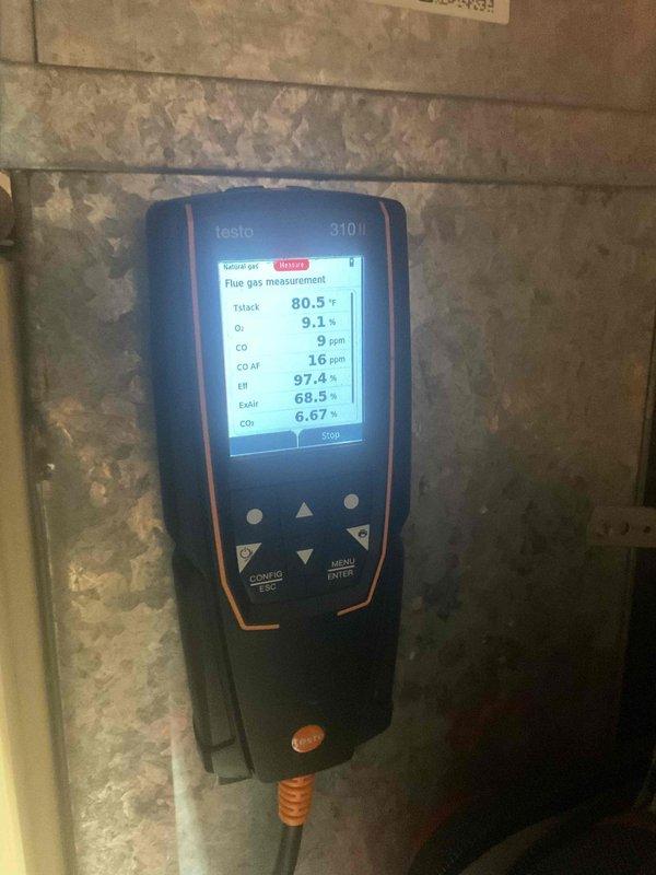 Performed furnace tune-up with comprehensive combustion analysis using Testo 310 analyzer, confirming optimal system efficiency at 97.4% with all safety parameters within acceptable ranges (CO at 9 ppm). Visual inspection of heat exchanger and components revealed no operational issues or safety concerns.
