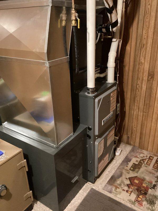 Performed comprehensive furnace tune-up service on three units: main home furnace, garage hanging unit, and outbuilding furnace. Main home and garage units were in good working condition with clean components and proper electrical specifications. Both units demonstrated appropriate temperature rise and operated normally during 15-minute test cycles. Identified critical issues with outbuilding furnace including cracked burner inlet on heat exchanger and excessive blower play with out-of-spec capacitor. Tagged outbuilding furnace due to safety concerns and scheduled estimate for heat exchanger replacement.