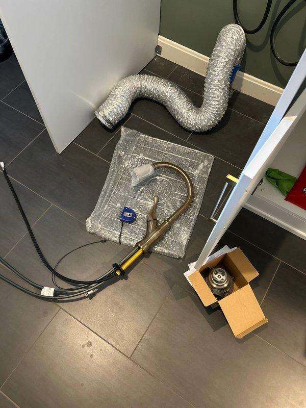 Completed installation of customer-supplied sink, faucet, basket strainer and P-trap assembly in laundry room. Properly connected new fixtures to existing plumbing lines and verified operation with no leaks.
