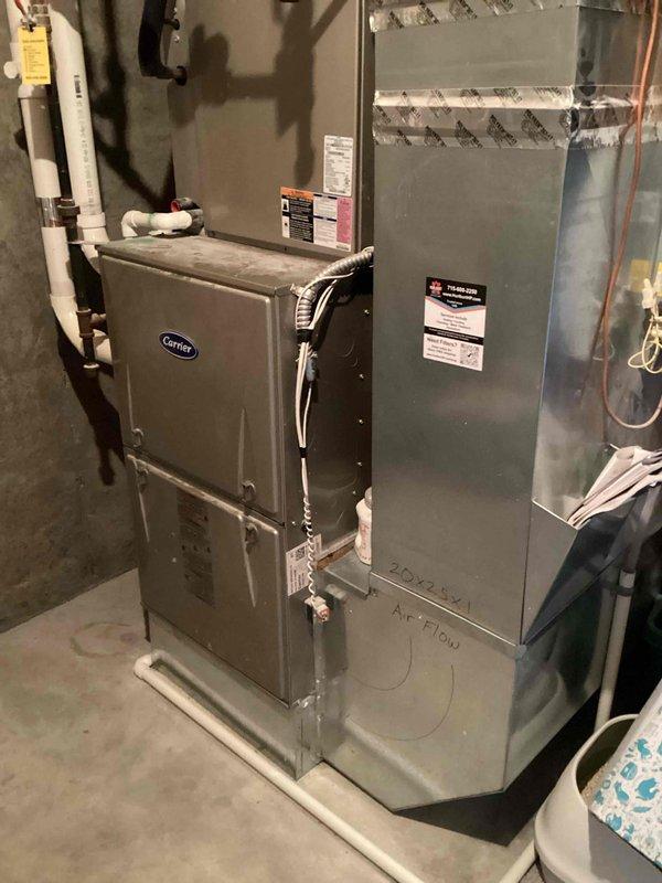 Performed replacement of blower motor and capacitor on Carrier HVAC system located in basement. Removed and cleaned blower wheel thoroughly. Installed new control board, motor, and capacitor. System was tested after reassembly and is now operating within normal parameters.