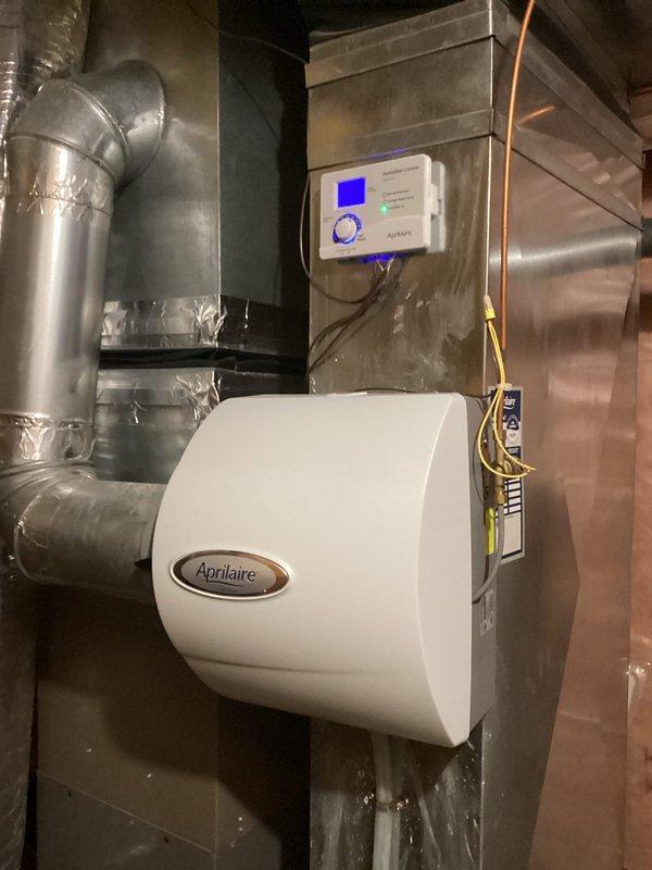 Replaced faulty humidistat on customer's HVAC system with new Aprilaire controller. Installation required accessing the basement-mounted furnace unit and properly connecting control wiring to the existing whole-home humidifier. System tested and confirmed operational after 2-hour service call.
