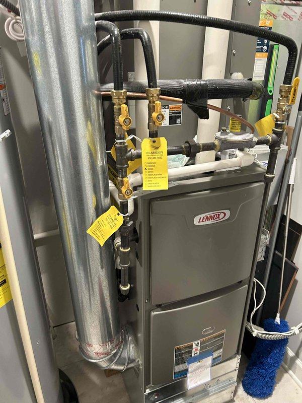 Adjusted temperature settings on 50-gallon A.O. Smith electric water heater (Model ENT-50130) that was delivering lukewarm water. Found top element set at lowest temperature while bottom element was at 120°F; corrected by setting both elements to consistent 120°F temperature to restore proper hot water function.