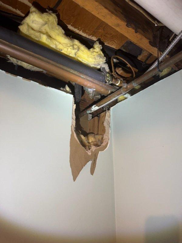 Repaired leaking main water line before the shut-off valve by replacing the connection below the ball valve. Additionally, replaced rotted P-trap under bathtub, which required re-piping the tub drain and associated water/vent piping. Coordinated with city water department for main water shut-off prior to performing repairs.