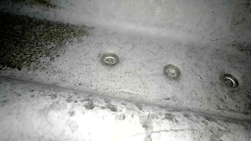 Performed annual furnace tune-up on FRP unit of undetermined age. Cleaned clogged condensate drain and trap to restore proper drainage. Documented system components with photos, including the Nest thermostat configuration and mounting hardware.