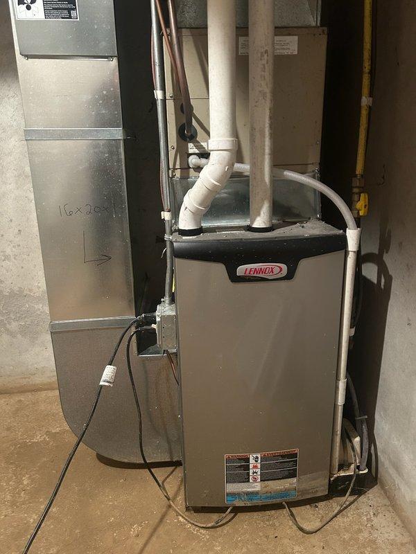Performed comprehensive tune-ups on two furnaces in newly purchased property. First unit (older, smaller) was functioning properly with clean filter and blower, clear routine lines, and intact heat exchanger. Second unit (newer, larger) showed signs of secondary heat exchanger leakage; adjusted furnace pitch by an additional 1/8 inch to correct the issue. Both systems demonstrated proper operation during 15-minute test runs with appropriate temperature rises (70° and 60° respectively). Recommended AC inspection in spring.