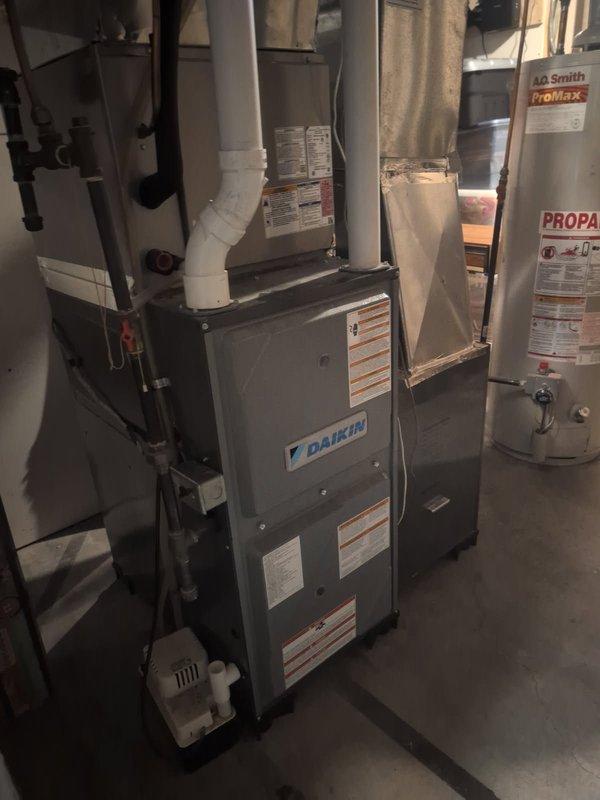 Diagnosed no-heat issue on 8-year-old Daikin furnace by identifying clogged pressure switch port on collector box. Performed remediation including port cleaning, drain flush, flame sensor cleaning, heat exchanger inspection, and burner check. Replaced burners as preventative measure due to debris accumulation in gas channel, ensuring proper ignition and system operation.