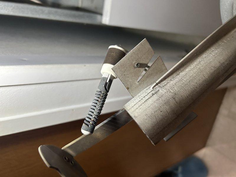 Responded to a no heat call where previous service had identified debris in pressure switch. Upon inspection, found additional debris buildup inside pressure switch port and exhaust ports. Cleared obstructions and verified furnace operation. Diagnosed weak flame signal indicated by flashing yellow light on control board. Determined igniter/flame sensor replacement needed, which will be ordered and installed on follow-up visit.