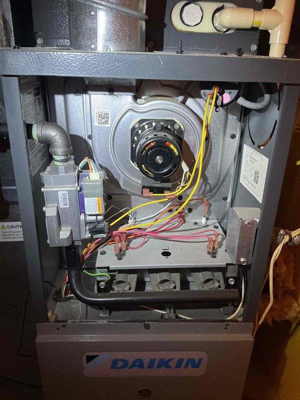 Diagnosed Daikin furnace with no heat condition. System was in lockout due to weak flame signal. Removed and replaced flame sensor to restore proper ignition sequence and system operation. Unit is now heating normally with good flame detection.