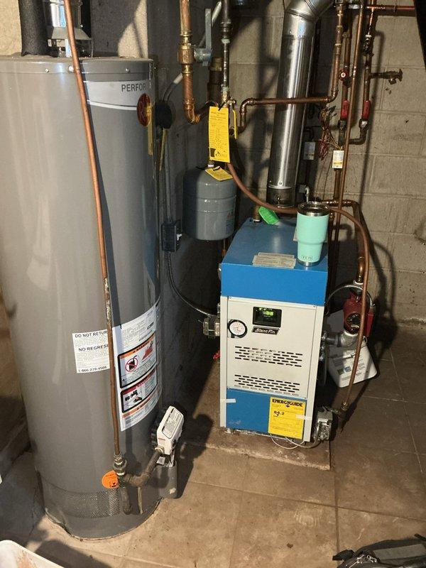 Responded to no-heat call for 5-year-old boiler with ignition failure. Diagnosed air-locked baseboards and non-functional pressure gauge. Purged all baseboard zones to restore proper circulation, successfully restoring heat to the system. Recommended replacement of pressure gauge for continued proper operation.