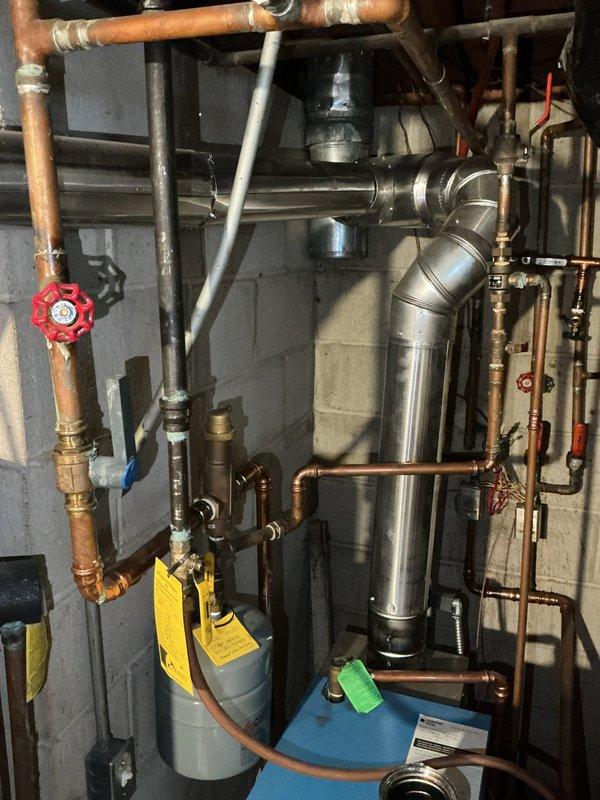 Responded to no-heat call for 5-year-old boiler with ignition failure. Diagnosed air-locked baseboards and non-functional pressure gauge. Purged all baseboard zones to restore proper circulation, successfully restoring heat to the system. Recommended replacement of pressure gauge for continued proper operation.