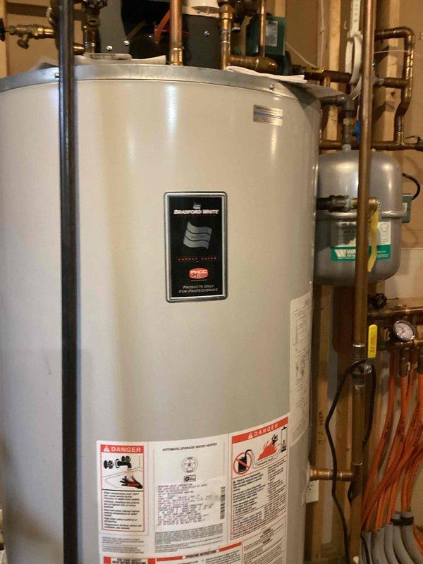 Responded to no hot water complaint for Bradford White tanked water heater. Diagnosed intermittent pilot light failure caused by dirty flame sensor and broken glow rod (customer attempted self-repair). Cleaned flame sensor and replaced damaged component to restore proper ignition and hot water service.