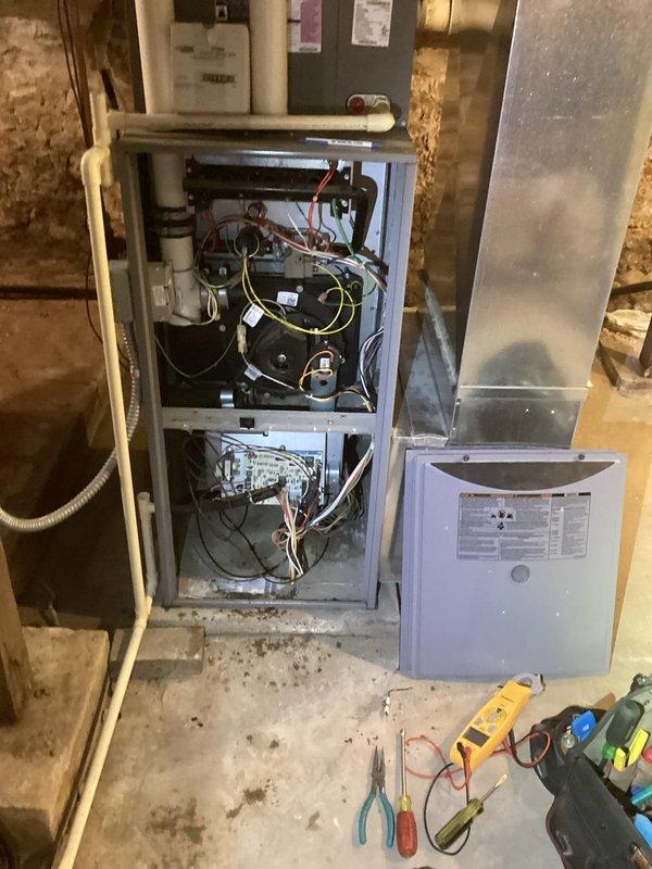 Responded to no heat complaint on 15-year-old LP furnace. Diagnosed plugged condensate trap which was cleaned to restore operation. Inspection revealed rusted burner assembly, deteriorating flame sensor, and noisy inducer motor. Heat exchanger inspection showed no cracks or holes. Recommended replacement of damaged components and scheduled follow-up service advisor consultation.