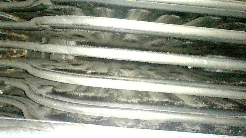 Responded to no heat call for 20+ year old natural gas furnace. Diagnosed clogged secondary heat exchanger causing unit to fire briefly before shutting down. Observed significant dust buildup on heat exchanger coils affecting system efficiency. Replaced secondary heat exchanger to restore proper heating function.