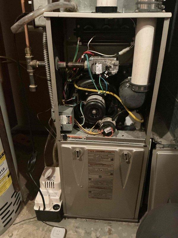 Diagnosed 13-year-old natural gas furnace with no heat issue; identified failed inducer draft motor as root cause. Submitted parts order form for replacement component and will schedule return service visit upon parts arrival.