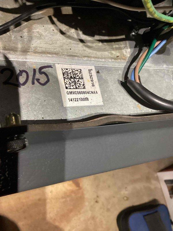 Responded to no heat call for Goodman GMVC960804CNAA furnace (manufactured 2015). Diagnosed locked combustion blower as the source of failure. Removed front panel, accessed internal components, and replaced combustion blower to restore proper operation. Enrolled customer in rewards membership program. Unit now functioning correctly with heat restored.