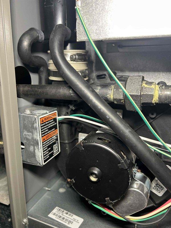 Performed comprehensive furnace tune-up on unit installed approximately one year ago. Inspection included heat exchanger integrity check, combustion analysis testing, gas pressure verification (high/low stage), examination of flame sensor and burners, and blower motor assessment. All components functioning properly with no immediate concerns noted; air filter in moderate condition, pressure switch cleaned, and thermostat operation verified.