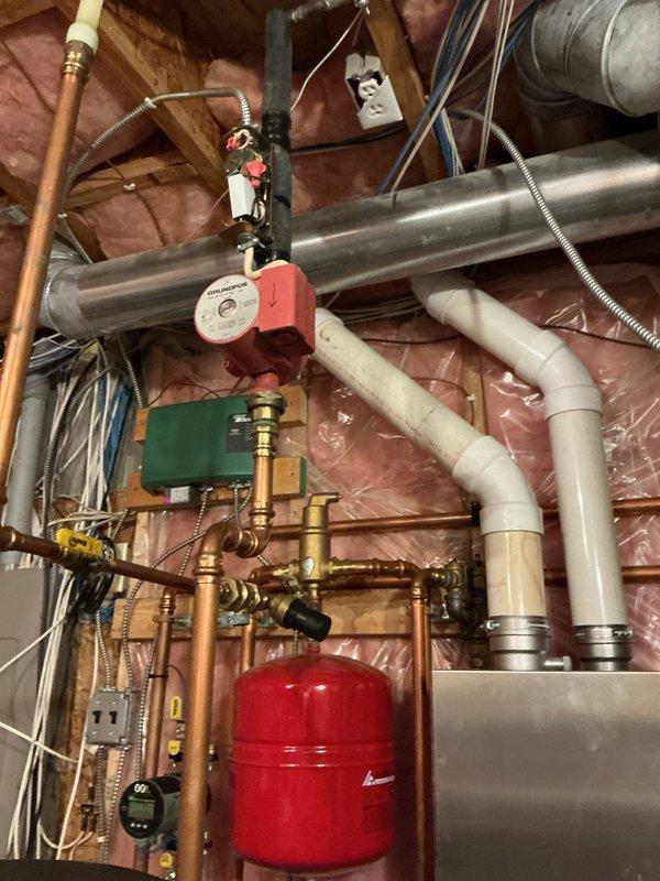 Diagnosed inadequate hot water temperature in IBC indirect water heater system. Identified faulty check valve by mixing valve causing temperature fluctuations from hot to lukewarm. Ordered replacement check valves (2) for the domestic side of boiler near mixing valve to restore proper operation.