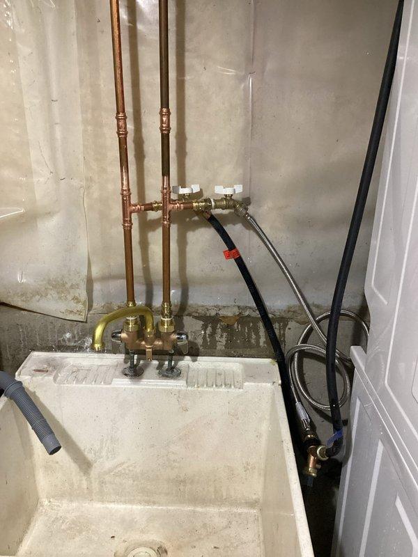 Successfully replaced customer's laundry faucet assembly, including installation of new laundry tees and water supply stops. Verified proper operation with no leaks at connection points.