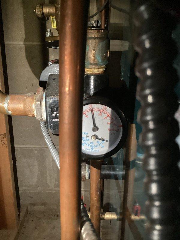 Diagnosed radiant heating system with no heat condition. Found boiler system was low on water, causing operational failure. Filled boiler system to proper pressure, bled air from lines, and restored normal heating function. Educated customer on manual water fill and air bleeding requirements for this particular boiler configuration.