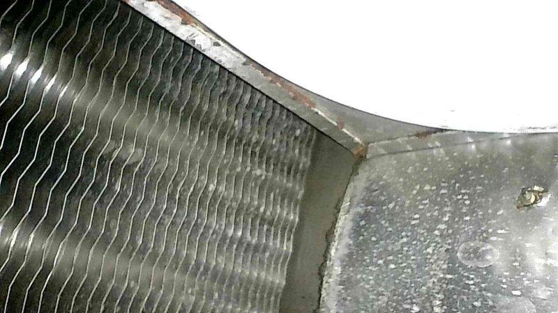 Responded to no heat service call for 12-year-old natural gas furnace experiencing short cycling. Diagnostic inspection revealed furnace would operate briefly then shut down. Visual examination identified critical failure: heat exchanger with visible hole/burn through, confirmed by photographic documentation. Equipment red-tagged due to safety hazard. Arranged emergency service priority and completed necessary documentation for heat exchanger replacement.